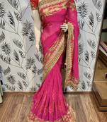 Pure georgette party wear saree in pink with embroidery work & crystal stone work