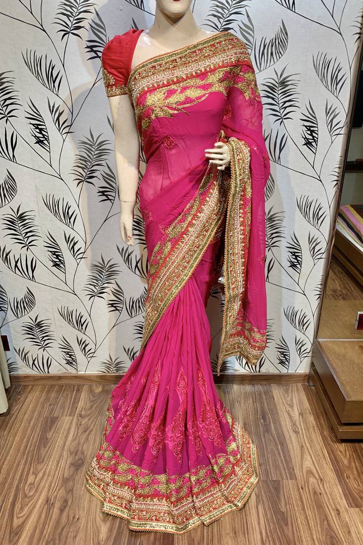 Pure georgette party wear saree in pink with embroidery work & crystal stone work