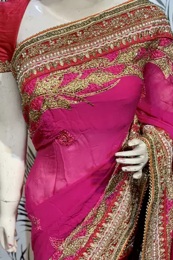 Pure georgette party wear saree in pink with embroidery work & crystal stone work