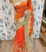 Pure silk party wear saree in orange with embroidery work & crystal stone work