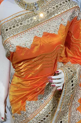 Pure silk party wear saree in orange with embroidery work & crystal stone work