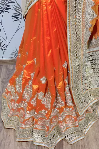 Pure silk party wear saree in orange with embroidery work & crystal stone work