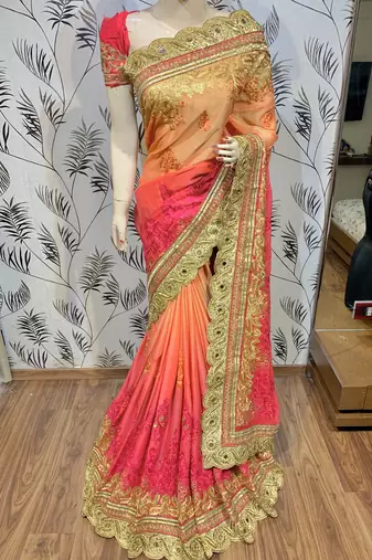 Pure chiffon wedding wear saree in orange with embroidery work & crystal stone work