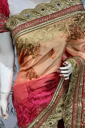 Pure chiffon wedding wear saree in orange with embroidery work & crystal stone work