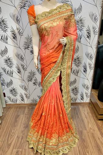 Pure chiffon wedding wear saree in orange with embroidery work & crystal stone work
