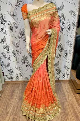Pure chiffon wedding wear saree in orange with embroidery work & crystal stone work