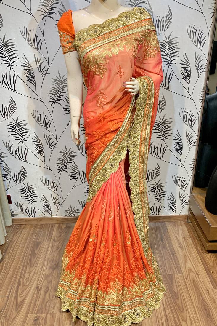 Pure chiffon wedding wear saree in orange with embroidery work & crystal stone work