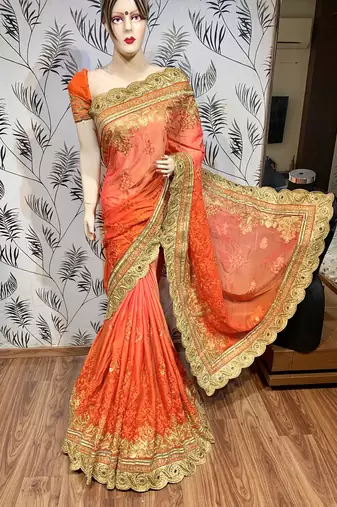 Pure chiffon wedding wear saree in orange with embroidery work & crystal stone work