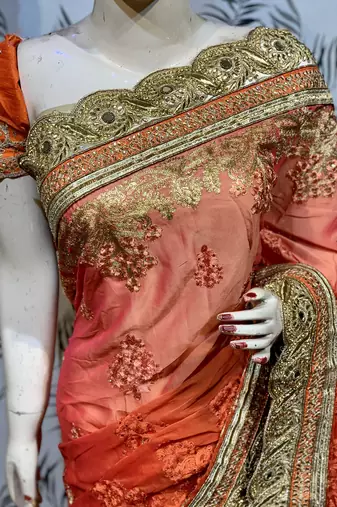 Pure chiffon wedding wear saree in orange with embroidery work & crystal stone work