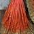 Pure chiffon wedding wear saree in orange with embroidery work & crystal stone work