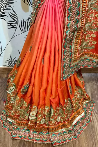 Heritage silk wedding wear saree in orange color with embroidery work & crystal stone work