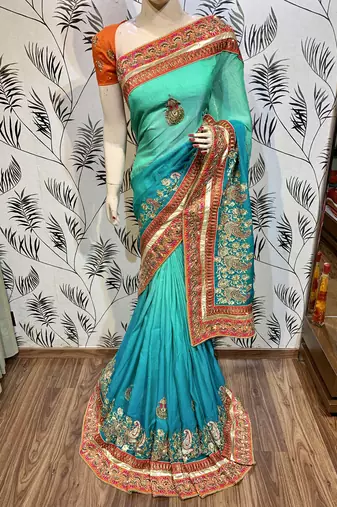 Heritage silk wedding wear saree in green color with embroidery work & crystal stone work
