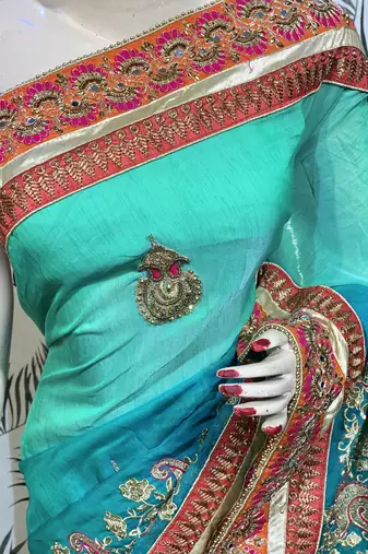 Heritage silk wedding wear saree in green color with embroidery work & crystal stone work