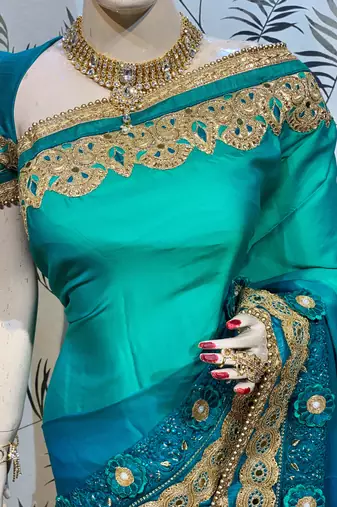 Shadow silk party wear saree in green with embroidery work & crystal stone work
