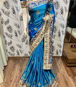 Pure silk wedding wear saree in blue with embroidery work & handwork