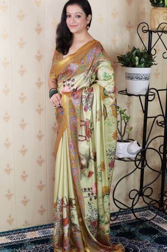 Green tussar silk kalamkari print zari woven border saree with contrast blouse piece