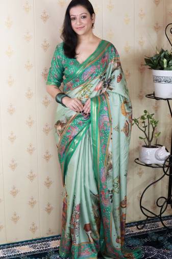 Sea green tussar silk kalamkari print zari woven border saree with contrast blouse piece