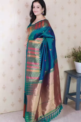 Teal soft silk floral meenakari zari weaving saree with matching blouse piece