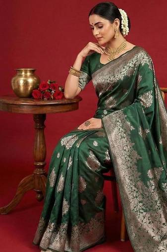 Dark green color woven work silk blend saree with blouse