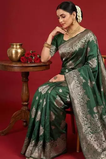 Dark green color woven work silk blend saree with blouse