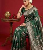 Dark green color woven work silk blend saree with blouse