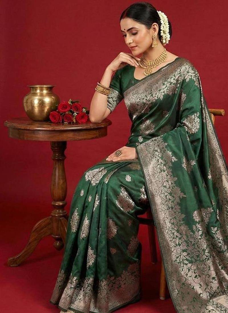Dark green color woven work silk blend saree with blouse