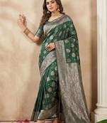 Dark green color woven work silk blend saree with blouse