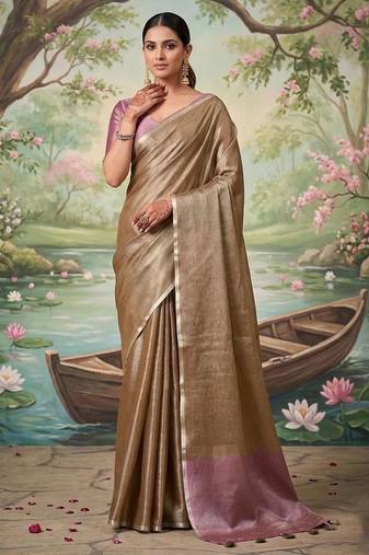 Brown color solid tissue silk plain saree with blouse