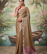 Brown color solid tissue silk plain saree with blouse