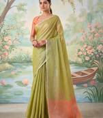 Green color solid tissue silk plain saree with blouse