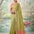 Green color solid tissue silk plain saree with blouse