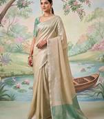 Beige color solid tissue silk plain saree with blouse