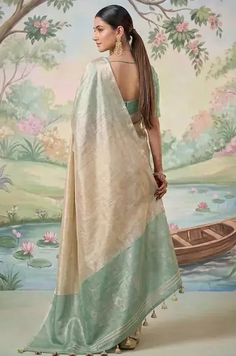 Beige color solid tissue silk blend plain saree with blouse