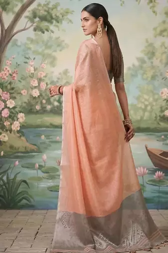 Peach color solid tissue silk blend plain saree with blouse