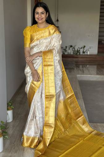  cream jacquard silk blend light weight saree with unstitched blouse