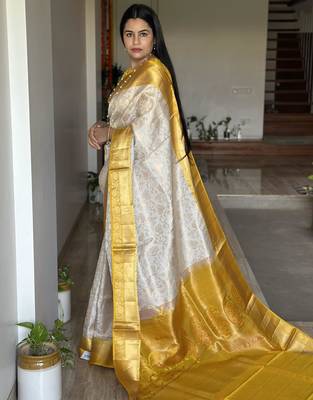  cream jacquard silk blend light weight saree with unstitched blouse 2