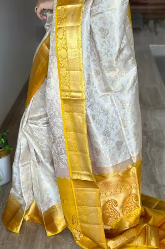 cream jacquard silk blend light weight saree with unstitched blouse