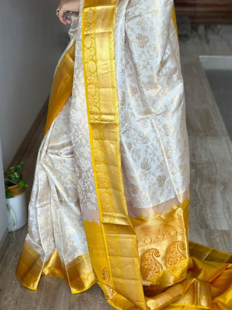  cream jacquard silk blend light weight saree with unstitched blouse