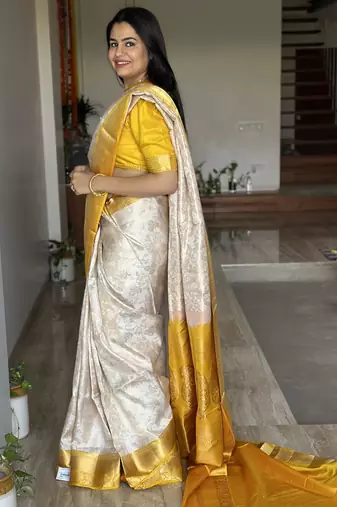  cream jacquard silk blend light weight saree with unstitched blouse