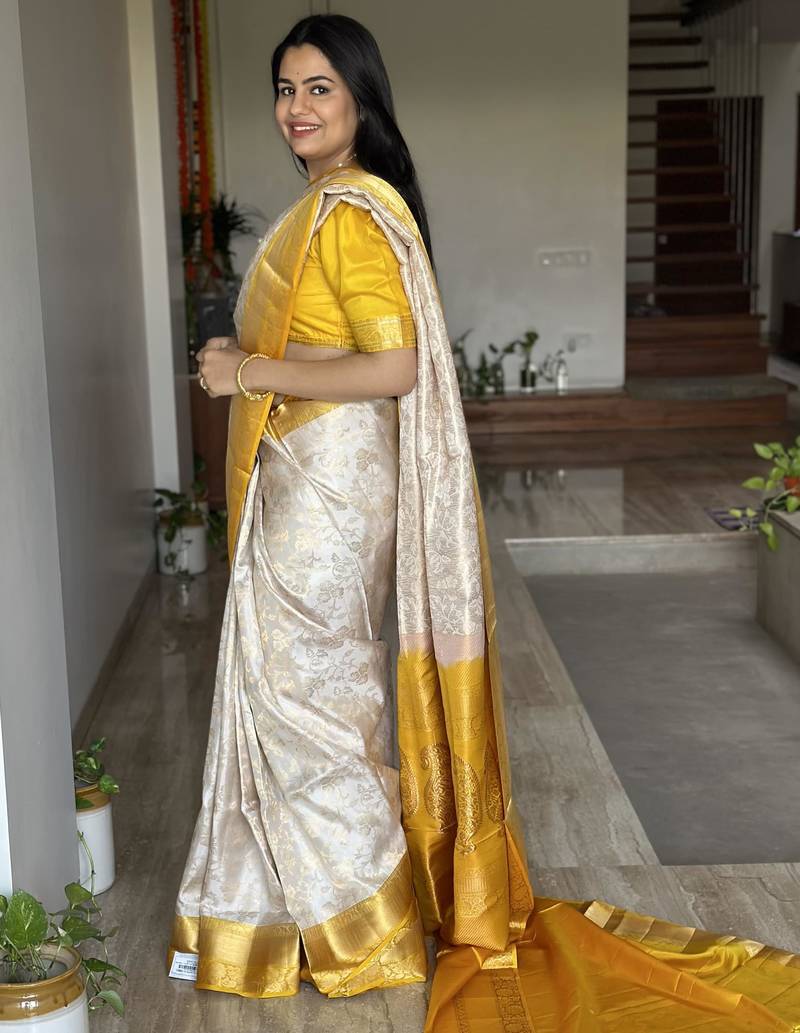  cream jacquard silk blend light weight saree with unstitched blouse