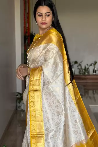  cream jacquard silk blend light weight saree with unstitched blouse