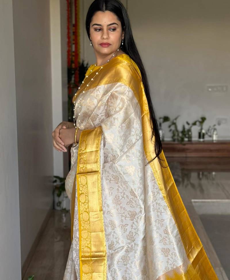  cream jacquard silk blend light weight saree with unstitched blouse