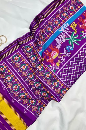 Purple Color Patola-Style Figure Print And Zari Lining Stripe Border art silk saree