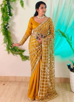 Yellow soft fandy sattin silk with mirror work lace border saree 1