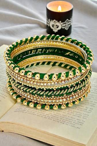 Gold plated set of 11 cz green silk thread bangle set