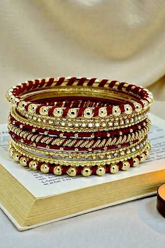 Gold plated set of 11 cz maroon silk thread bangle set