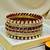 Gold plated set of 11 cz maroon silk thread bangle set