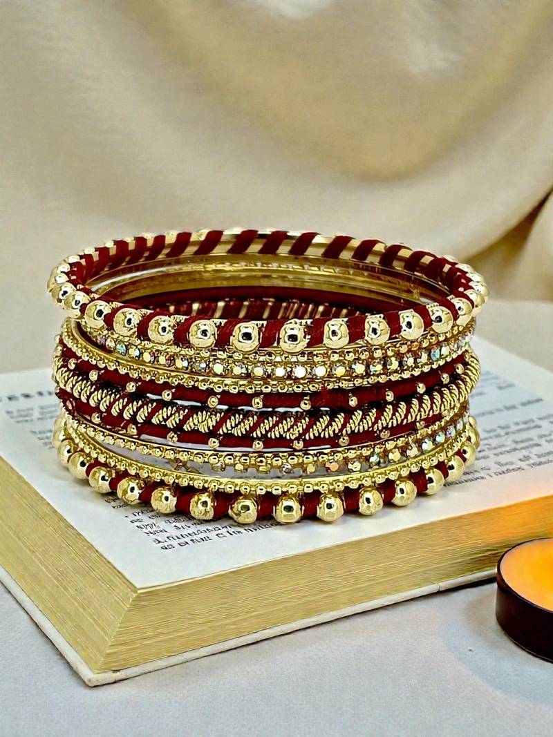 Gold plated set of 11 cz maroon silk thread bangle set
