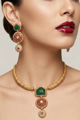 Handcrafted gold-plated ethnic necklace set with green carved stones & red floral pendant - bridal wedding jewelry