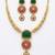 Handcrafted gold-plated ethnic necklace set with green carved stones & red floral pendant - bridal wedding jewelry